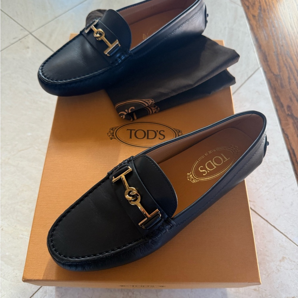 Tod's Black Leather Loafers with Gold Accent